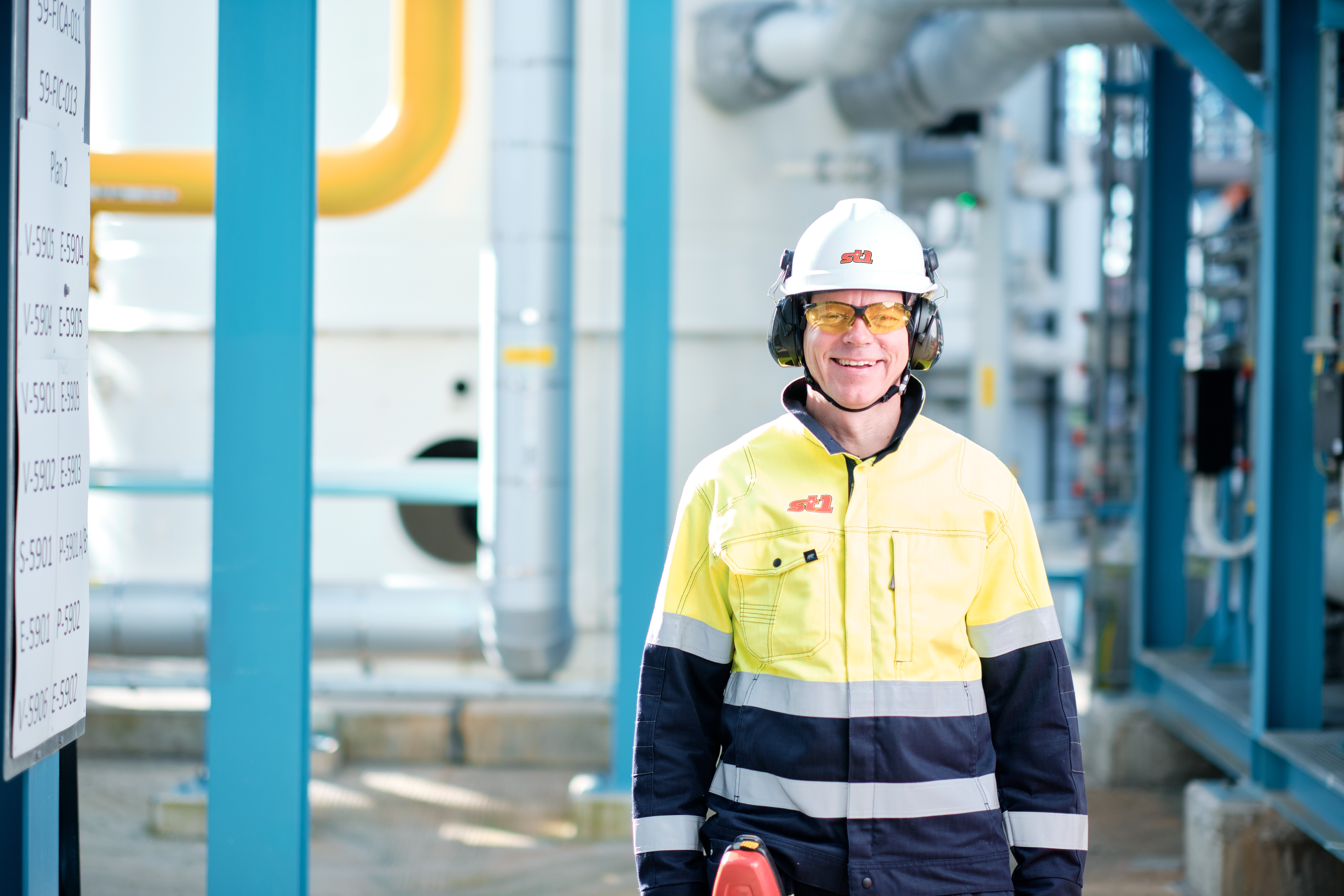 Refinery employee standing